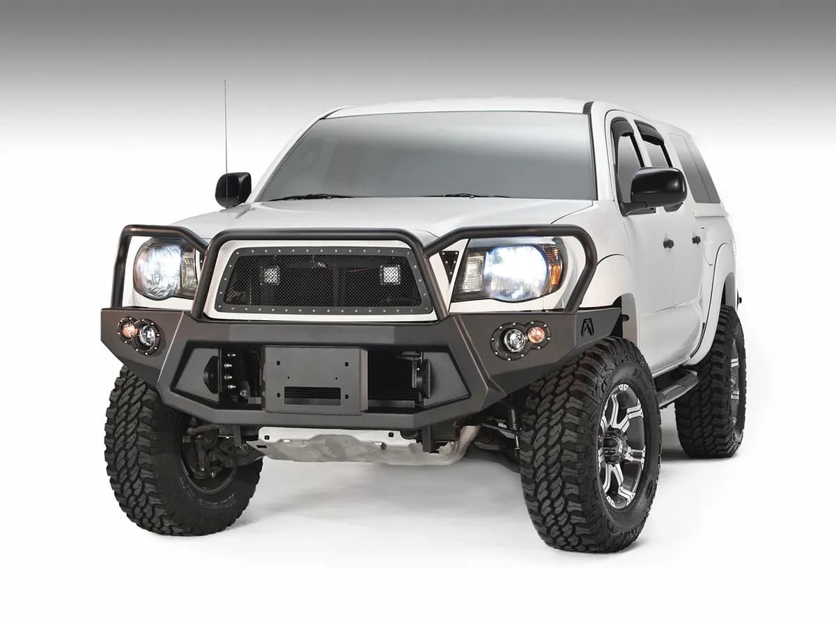 Premium Heavy Duty Winch Front Bumper; 2 Stage Black Powder Coated; w/Full Grill Guard; Incl. 1in. D-Ring Mounts/Light Cut-Outs w/Fab Fours 90mm Fog Lamps/60mm Turn Signals;