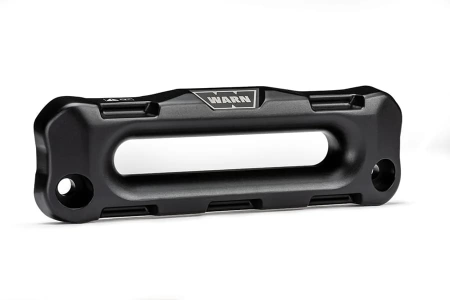 WARN - Offset forged aluminum hawse fairlead for bumpers that require winch to mount foot forward such as ARB. 1.5 in. thickness with a black hard-anodized f